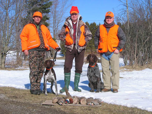 Peter with  GSP Boston, Neil, and John with his Drathaar after hunt at Ruffwood Game Farm